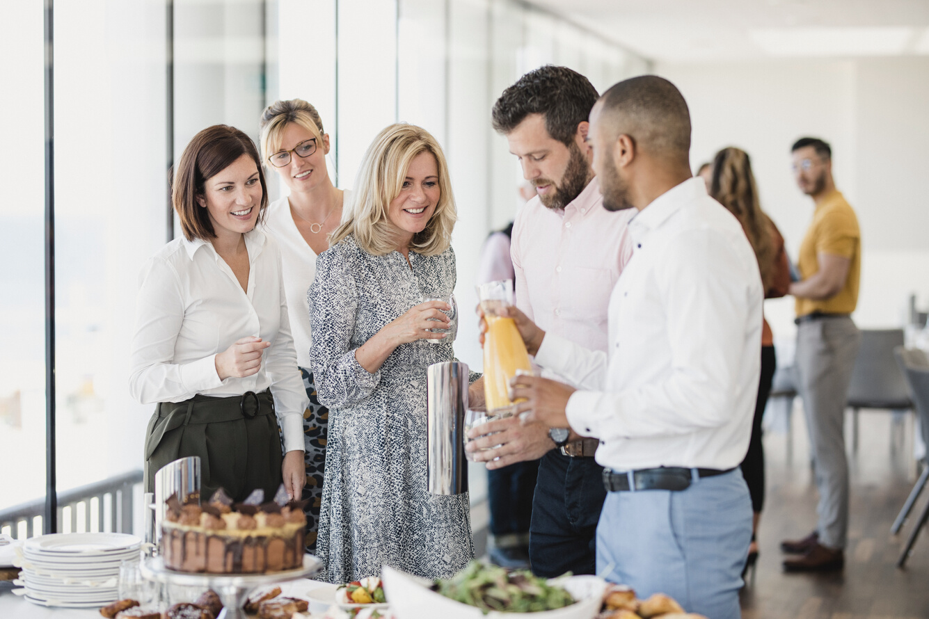 Business people enjoying refreshments at corporate event